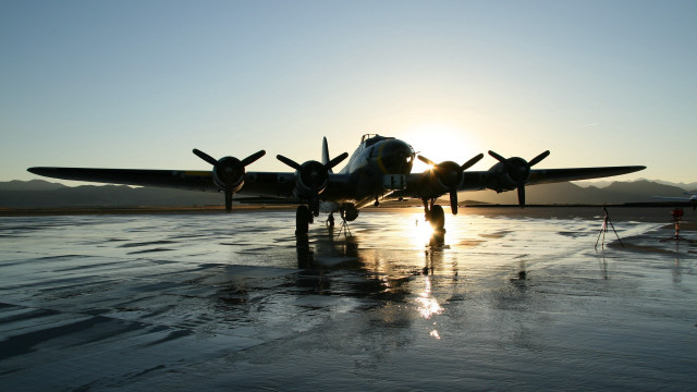 Plane sunset runway mountains person free wallpaper - medium preview image