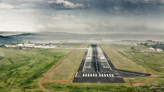 Runway plane field mountains cloudy free wallpaper - medium preview image