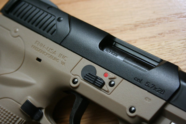 Gun wooden table black handle free wallpaper - medium preview image