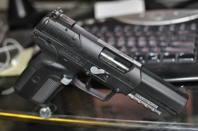 Gun desk keyboard mouse blurry free wallpaper - medium preview image