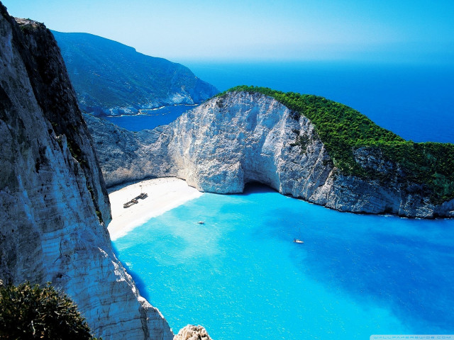 Beach rock formation blue water #4 free wallpaper - medium preview image