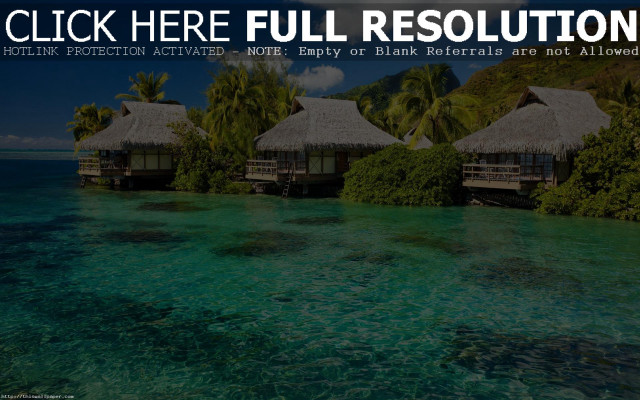 Huts hillside ocean lush green free wallpaper - medium preview image