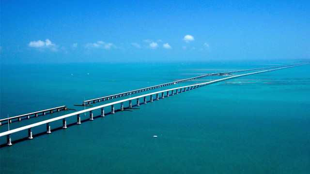 Long bridge spanning ocean blue free wallpaper - medium preview image