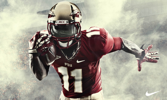Football player uniform holding ball #3 free wallpaper - medium preview image