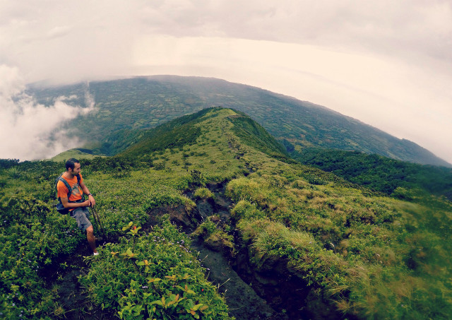 Man hiking mountain backpack clouds free wallpaper - medium preview image