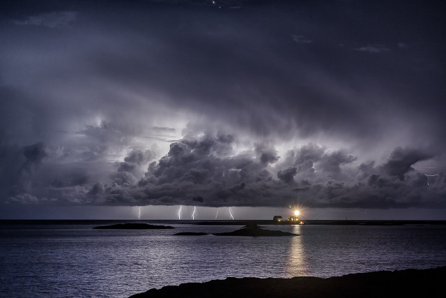 Storm coming water lighthouse distance free wallpaper - medium preview image