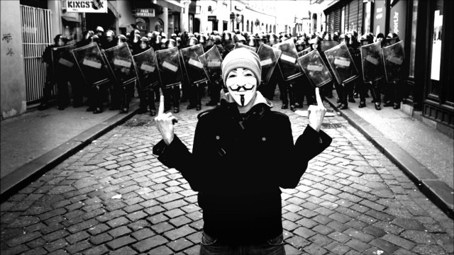 Masked person crowd flags banners free wallpaper - medium preview image
