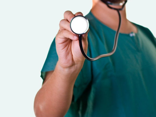 Man green shirt stethoscope holding free wallpaper - medium preview image