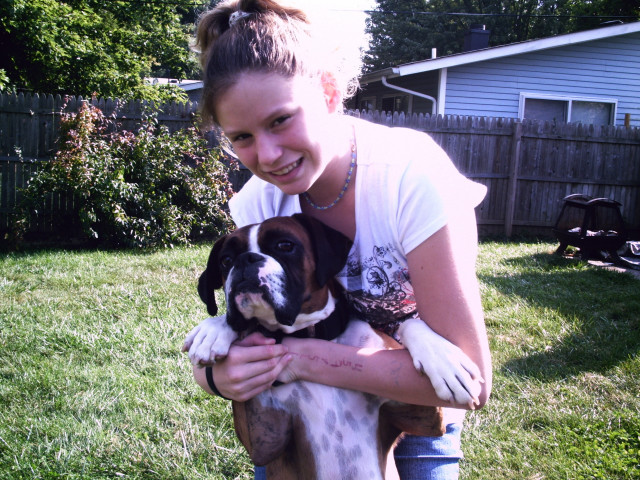Woman holding dog grass house free wallpaper - medium preview image