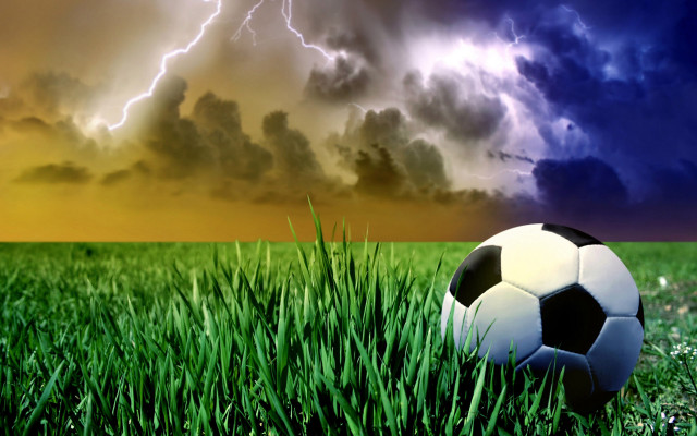 Soccer ball grass storm cloud free wallpaper - medium preview image