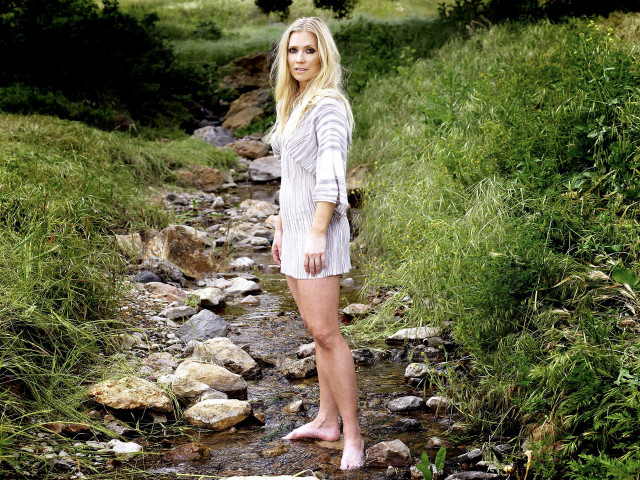 Woman standing stream field grass free wallpaper - medium preview image