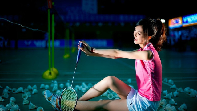 Woman sitting ground tennis racket free wallpaper - medium preview image