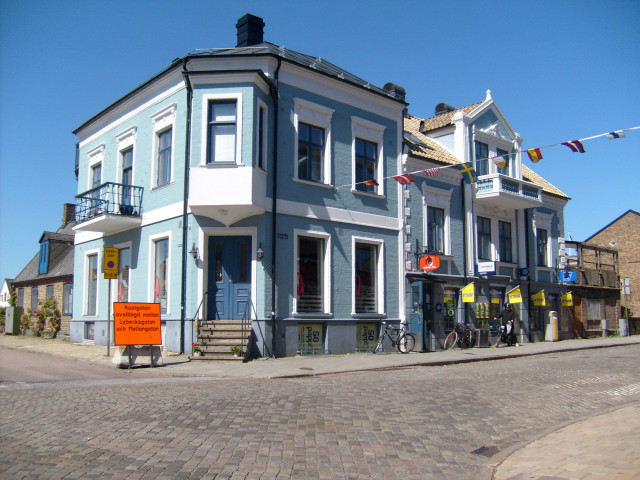 Blue building bicycle parked street free wallpaper - medium preview image