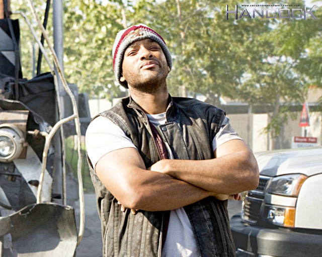 Man standing truck arms crossed free wallpaper - medium preview image