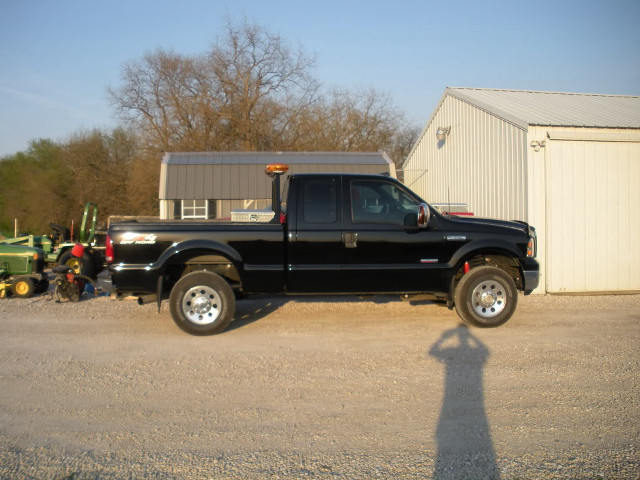 Black truck building tractor man free wallpaper - medium preview image