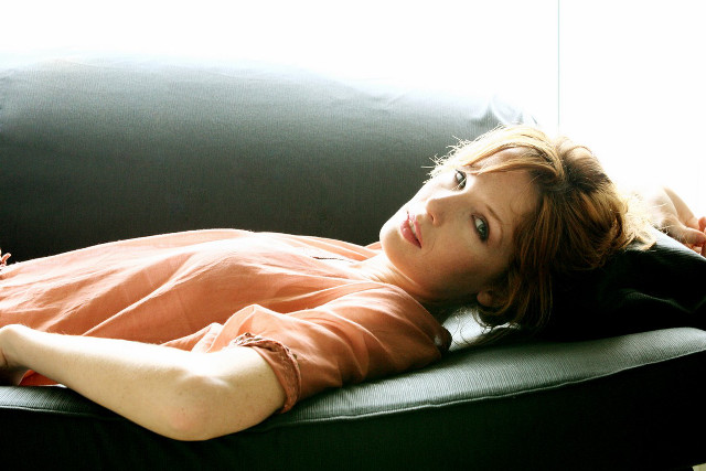 Woman couch legs crossed head free wallpaper for desktop - medium preview image