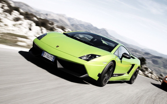 Two cars driving mountains orange free wallpaper - medium preview image