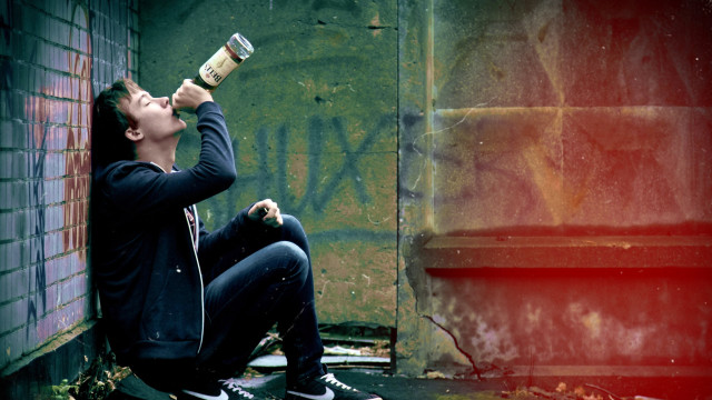 Man sitting drinking wine bottle free wallpaper - medium preview image