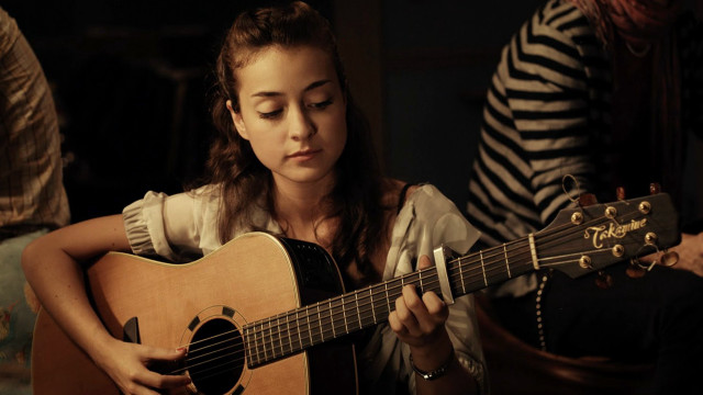Woman playing guitar room zebra free wallpaper - medium preview image