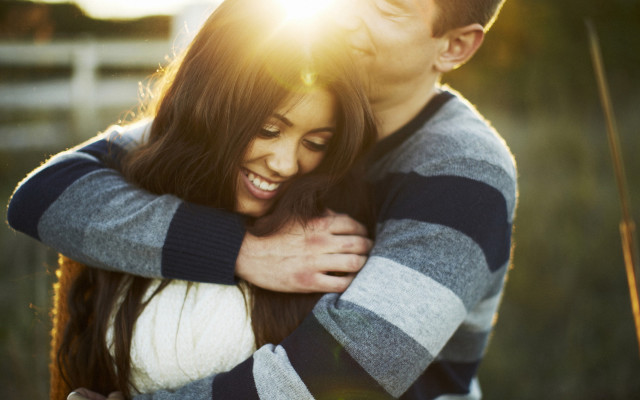 Man woman hugging field grass #2 free wallpaper - medium preview image
