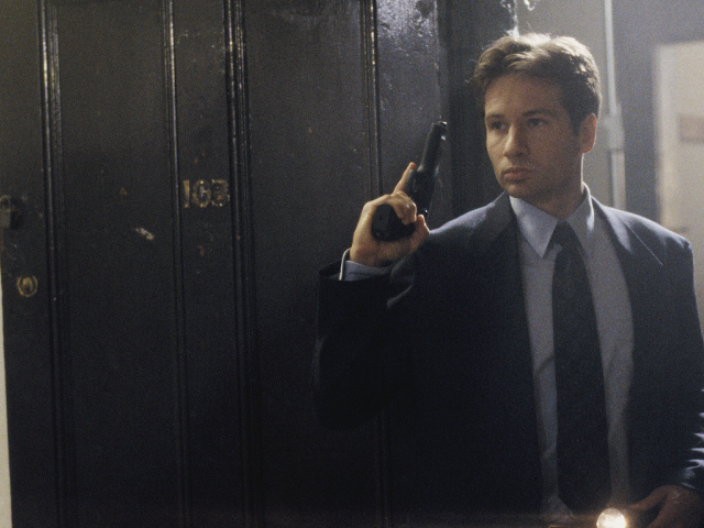 Man suit gun mirror camera free wallpaper - medium preview image