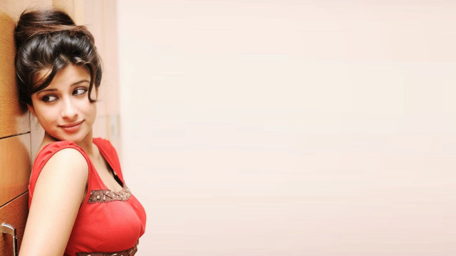 Woman red dress leaning wall #5 free wallpaper - medium preview image