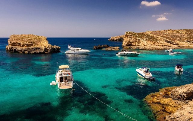 Boats rocky shore ocean blue free wallpaper - medium preview image