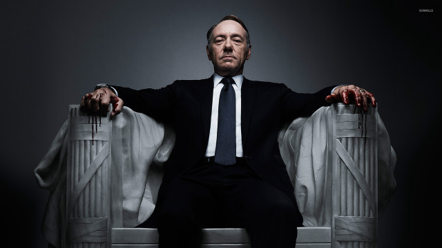 Man suit tie chair crossed free wallpaper - medium preview image