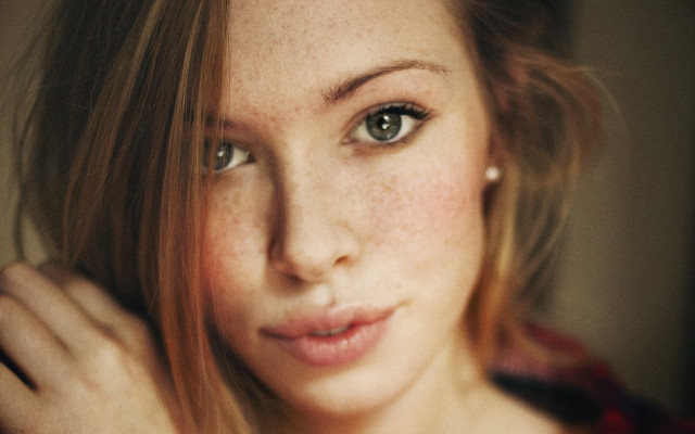 Woman freckled hair ring pose free wallpaper - medium preview image