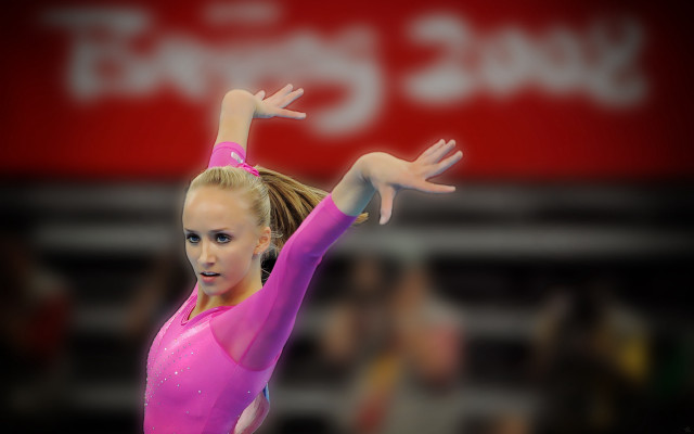 Woman pink leotard balance beam free wallpaper - medium preview image