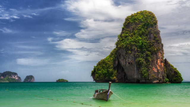 Boat water rock formation ocean free wallpaper - medium preview image