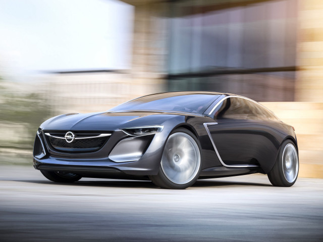 Car driving street building clock free wallpaper - medium preview image