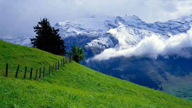 Grassy hill fence mountain clouds #3 free wallpaper - medium preview image