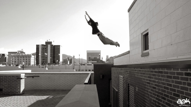 Person jumping skateboard air city free wallpaper - medium preview image