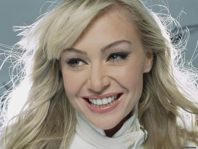 Blonde woman smiling wind portrait free wallpaper - medium preview image