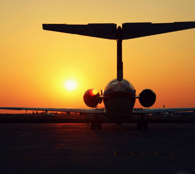 Plane sunset runway orange sky free wallpaper - medium preview image