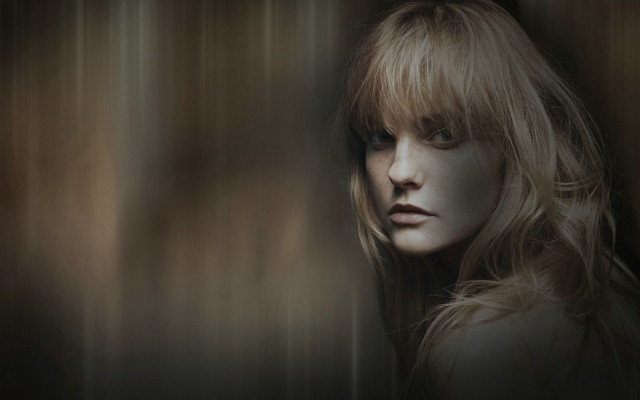 Blonde woman serious look standing free wallpaper - medium preview image