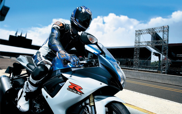 Man motorcycle road bridge building free wallpaper - medium preview image
