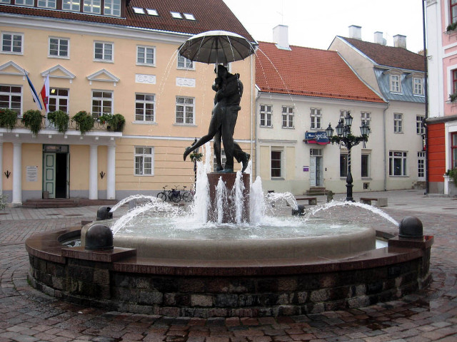 Statue woman umbrella fountain town free wallpaper - medium preview image
