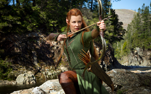 Woman green dress bow arrow #2 free wallpaper - medium preview image