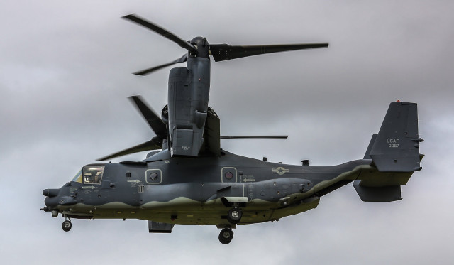 Military helicopter flying cloudy sky free wallpaper - medium preview image