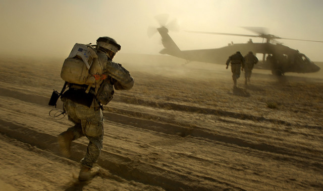 Soldiers walking dirt field helicopter #2 free wallpaper - medium preview image
