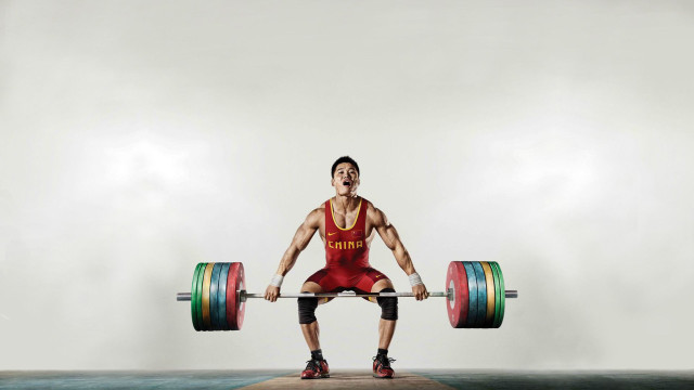 Man squat barbell weight plate free wallpaper - medium preview image