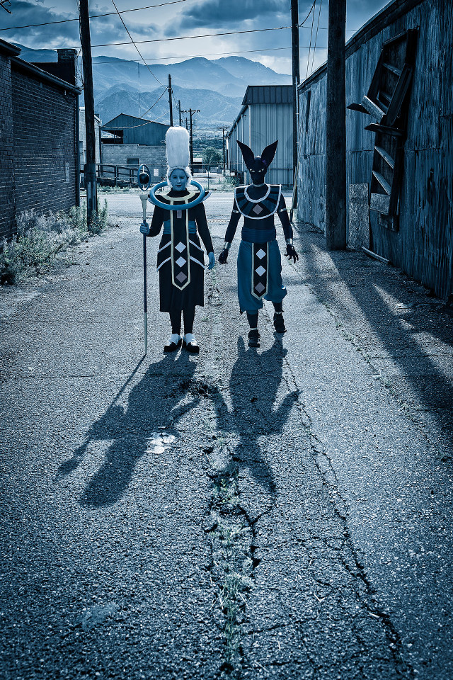 Costumed couple holding hands walking free wallpaper - medium preview image