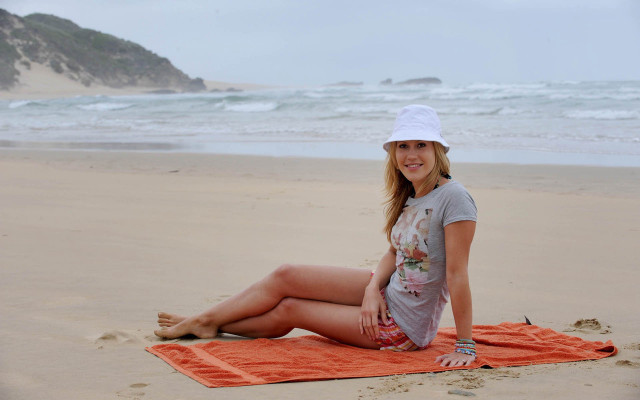 Woman beach towel smiling camera free wallpaper - medium preview image