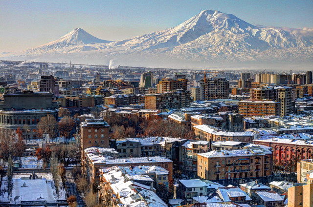 City mountain snow buildings foreground free wallpaper - medium preview image