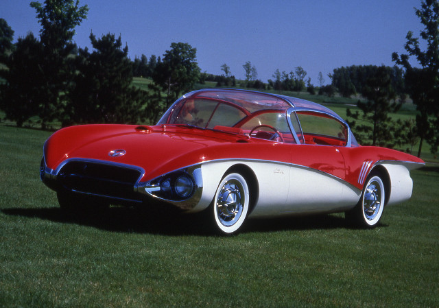 Red white car green field free wallpaper - medium preview image