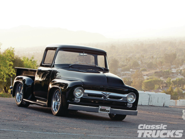 Black truck parked road forest free wallpaper - medium preview image