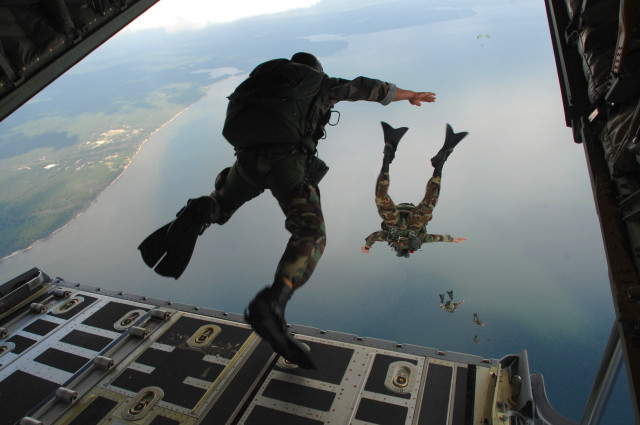 Camouflage man jumps plane water free wallpaper - medium preview image
