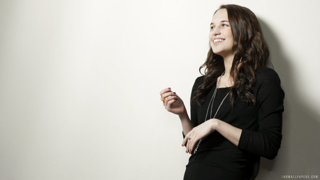 Woman smiling white wall hands free wallpaper - medium preview image